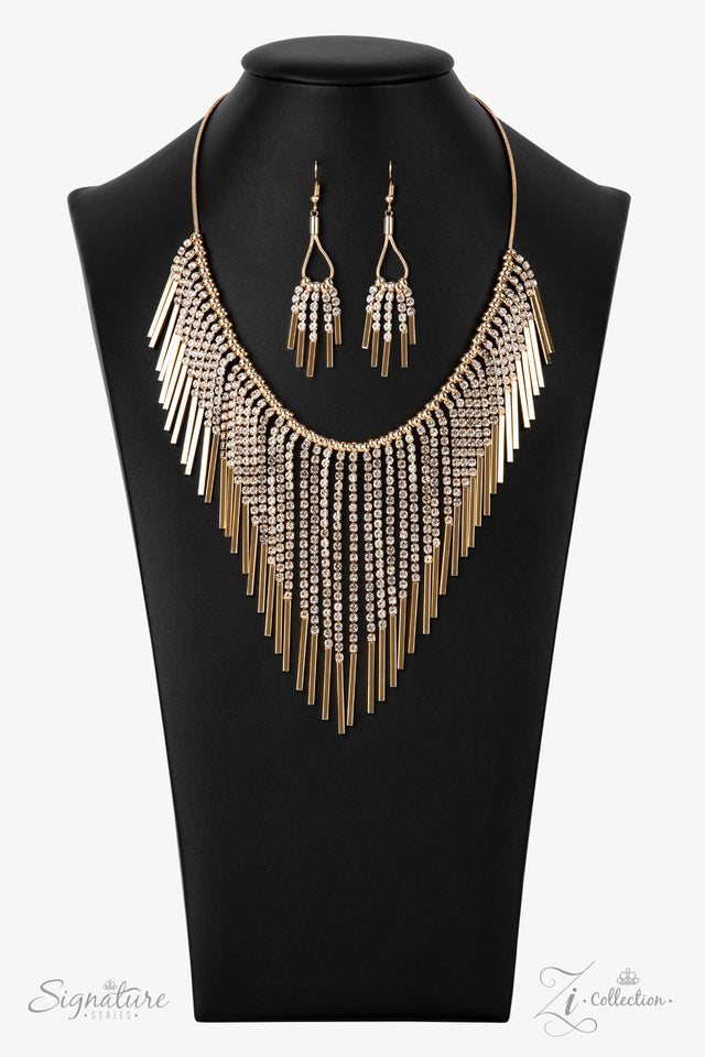 Seemingly separated by dainty gold beads, shimmery strands of white rhinestones majestically morph into gold rectangular frames https://paparazziaccessories.com/shop/682c5bc0df0930743e7a/#:~:text=Seemingly%20separated%20by,winner%2C%20Amber%20B.